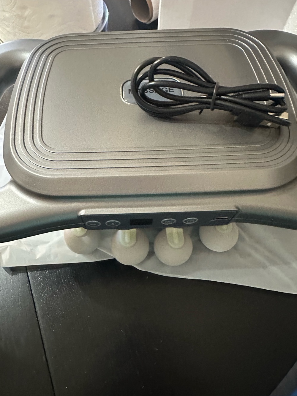 Portable Black Electronic Massager with Removable Charging Cord